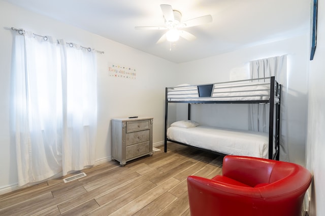 bedroom featuring hardwood / wood-style floors and ceiling fan