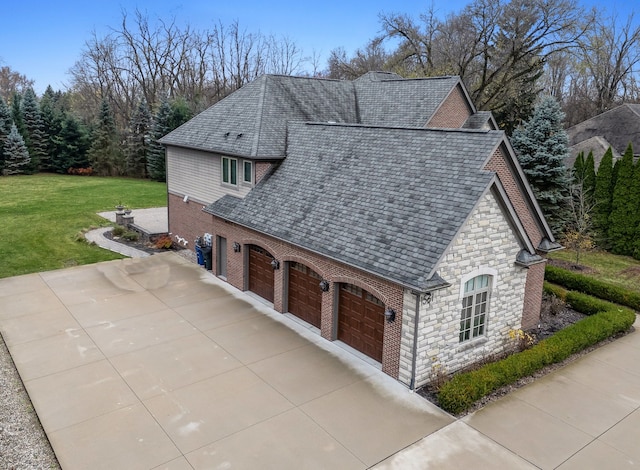 view of side of property with a yard