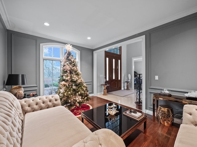 living room featuring hardwood / wood-style floors and ornamental molding