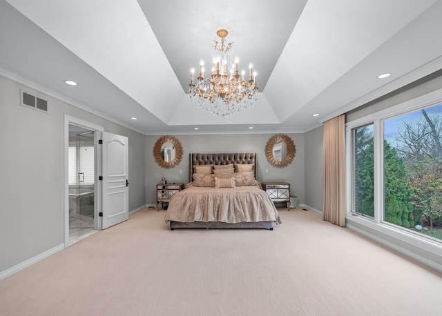 bedroom with connected bathroom, light carpet, ornamental molding, and an inviting chandelier