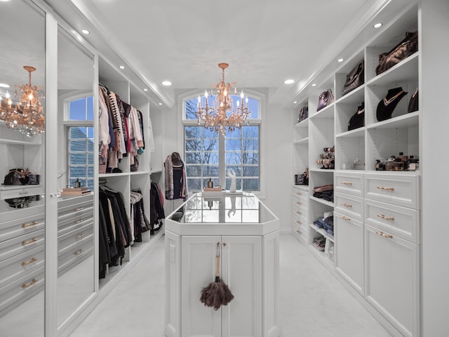 walk in closet featuring a chandelier