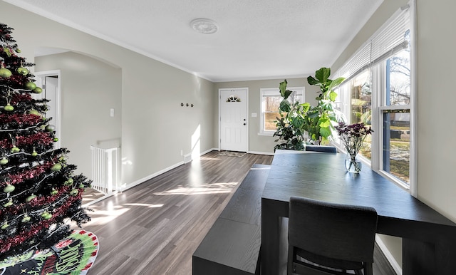 entrance foyer featuring a textured ceiling and dark hardwood / wood-style floors