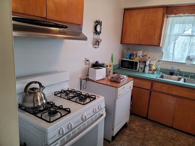 kitchen featuring white appliances and sink
