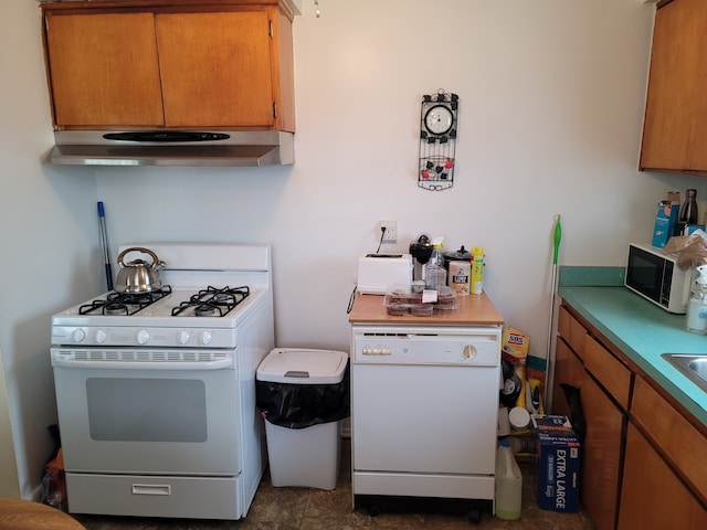 kitchen featuring tile patterned flooring and white appliances