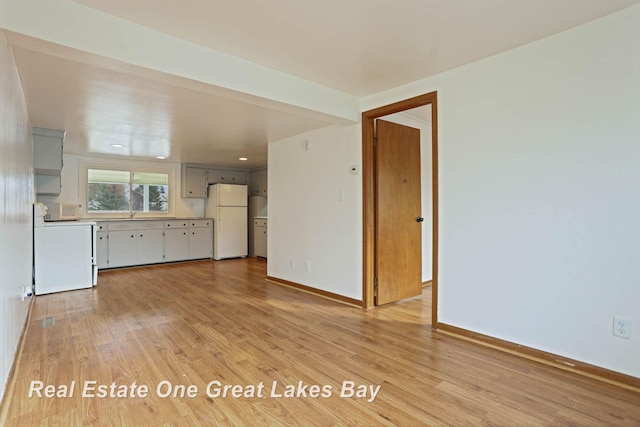 unfurnished living room with light hardwood / wood-style floors