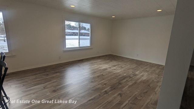 empty room featuring hardwood / wood-style flooring