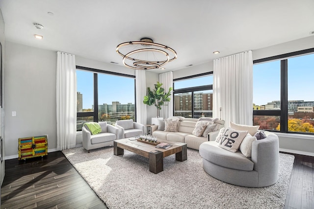 living room with a chandelier and dark hardwood / wood-style flooring