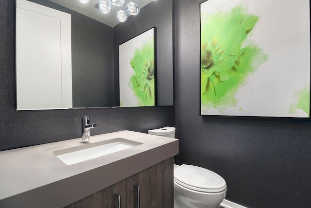 bathroom featuring decorative backsplash, vanity, and toilet