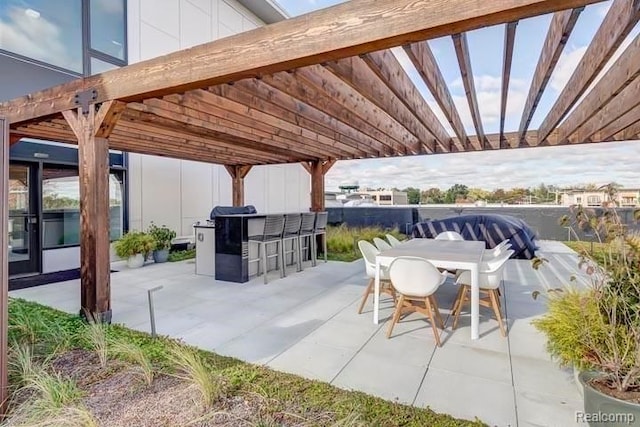 view of patio / terrace with a pergola and a bar