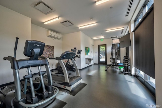 exercise room featuring a wall mounted AC