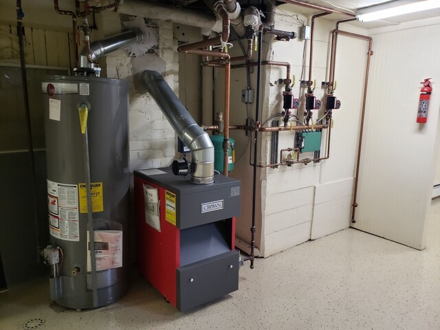 utility room featuring gas water heater