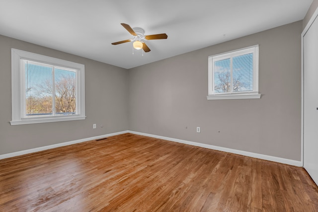 unfurnished room featuring ceiling fan and light hardwood / wood-style floors