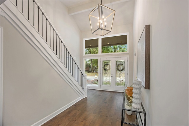 entrance foyer with french doors, dark wood-type flooring, beamed ceiling, high vaulted ceiling, and a chandelier