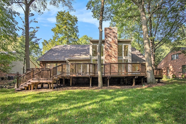 back of house with a lawn and a wooden deck