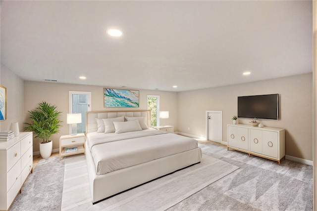 bedroom with light colored carpet