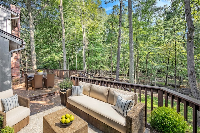 wooden terrace featuring an outdoor hangout area