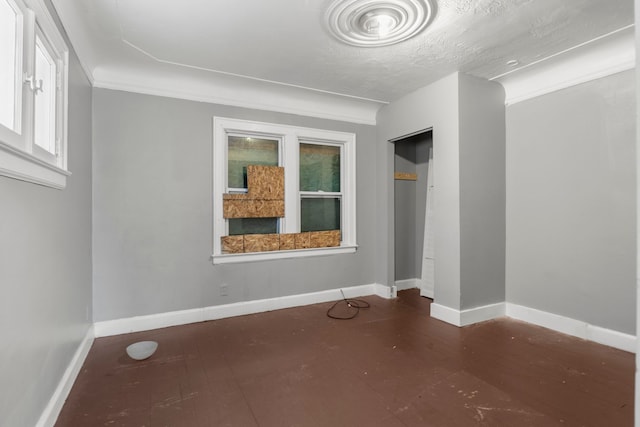 unfurnished bedroom with crown molding