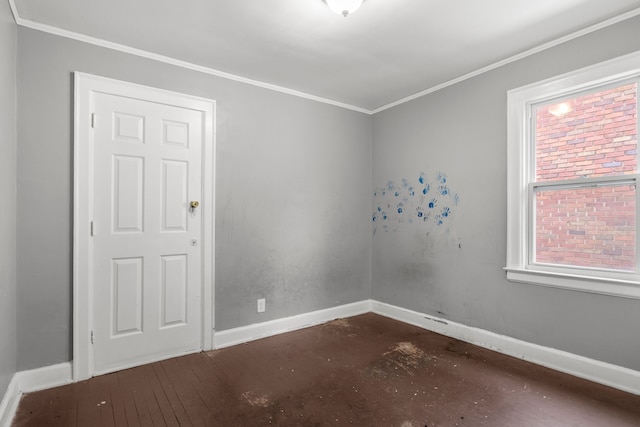 spare room featuring crown molding