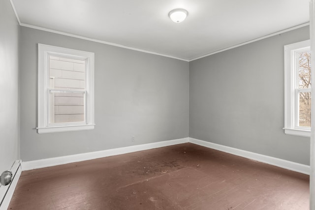 unfurnished room with ornamental molding and a baseboard radiator