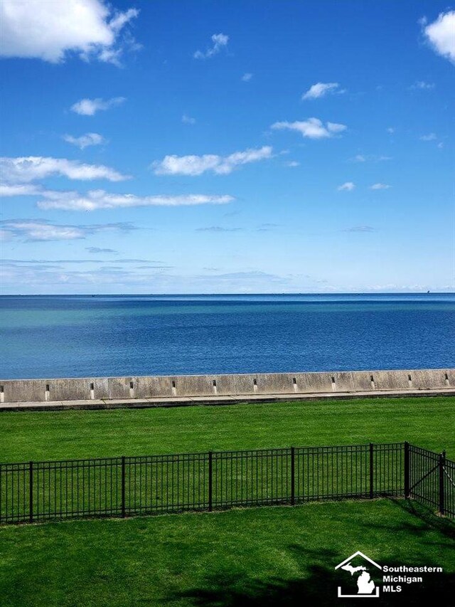 property view of water featuring fence