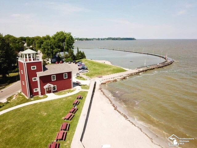 birds eye view of property with a view of the beach and a water view