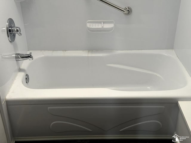 bathroom with a tub to relax in