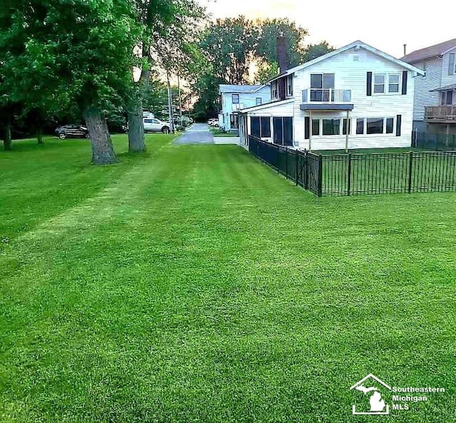 view of yard featuring a sunroom