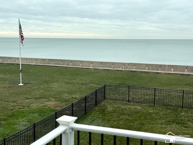 property view of water featuring fence