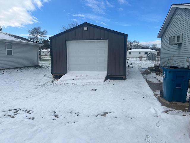 view of snow covered garage