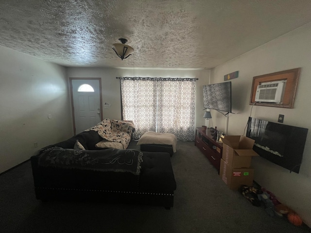 carpeted living room with a textured ceiling and an AC wall unit