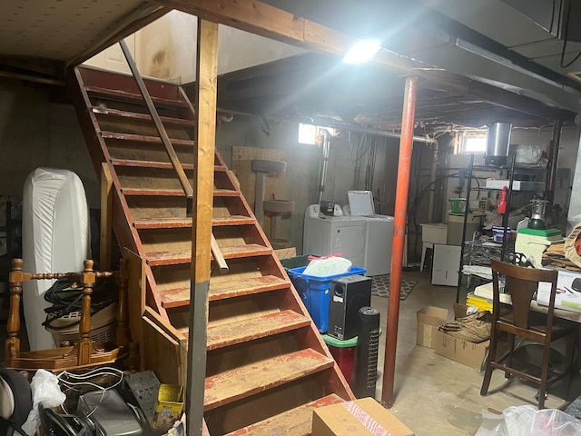 basement featuring washing machine and clothes dryer