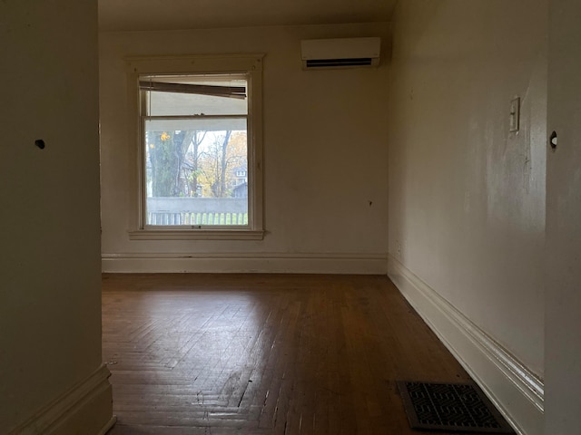 spare room with a wall mounted air conditioner