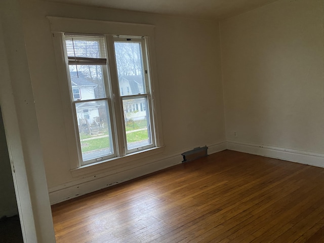 spare room featuring light wood-type flooring