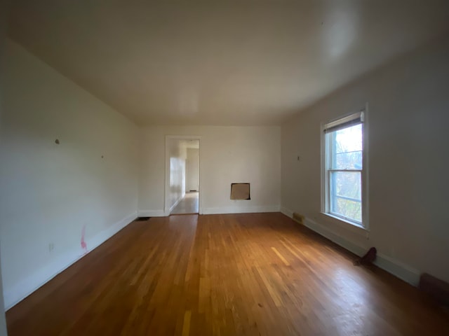 unfurnished room featuring hardwood / wood-style flooring