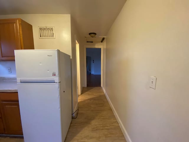 hallway featuring light hardwood / wood-style floors