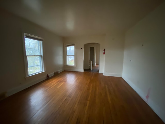 unfurnished room featuring hardwood / wood-style floors