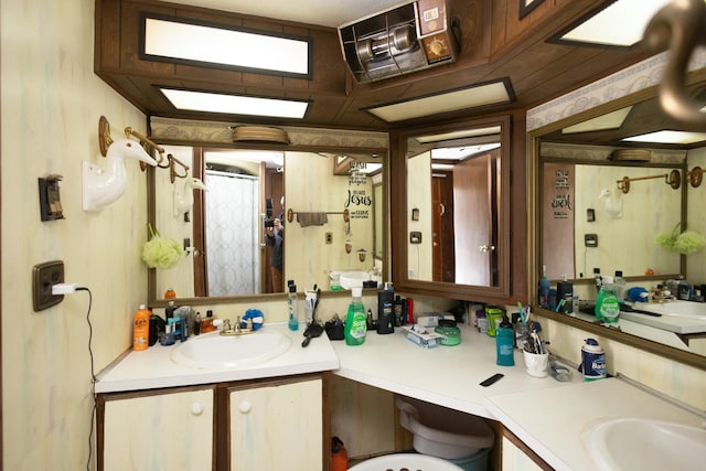 bathroom with vanity and walk in shower