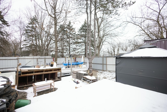 view of yard layered in snow