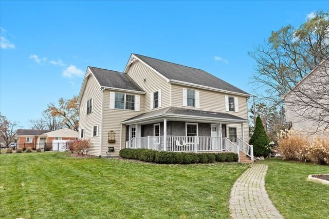 view of front facade with a front yard and a porch