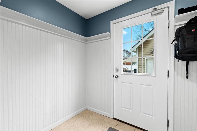 entryway with light tile patterned floors