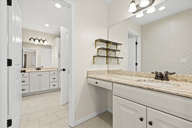 1807 Samoset Rd, Royal Oak, MI 48073 - full bathroom featuring tile patterned flooring, two vanities, a sink, baseboards, and recessed lighting
