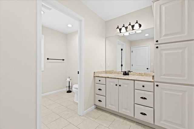 1807 Samoset Rd, Royal Oak, MI 48073 - bathroom featuring toilet, tile patterned floors, baseboards, and vanity