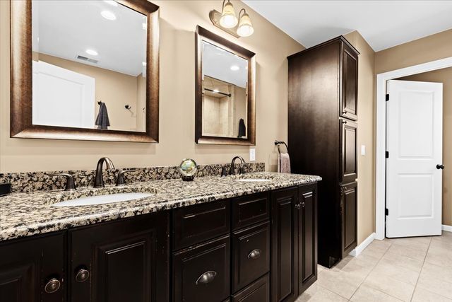 bathroom with tile patterned flooring and vanity