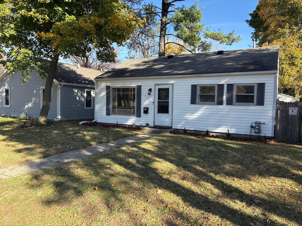 ranch-style house with a front lawn