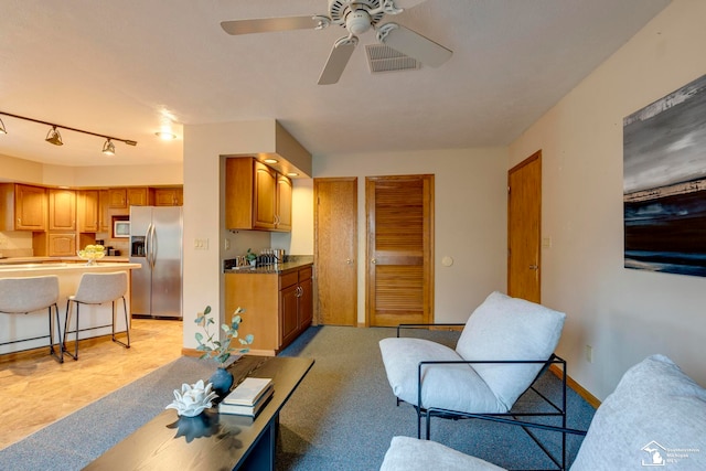 living room with ceiling fan