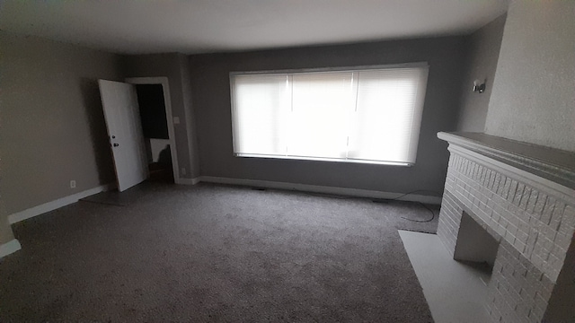 unfurnished living room with carpet