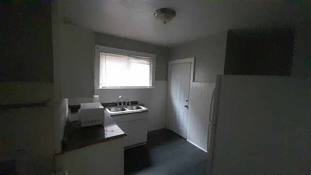 kitchen featuring fridge and sink