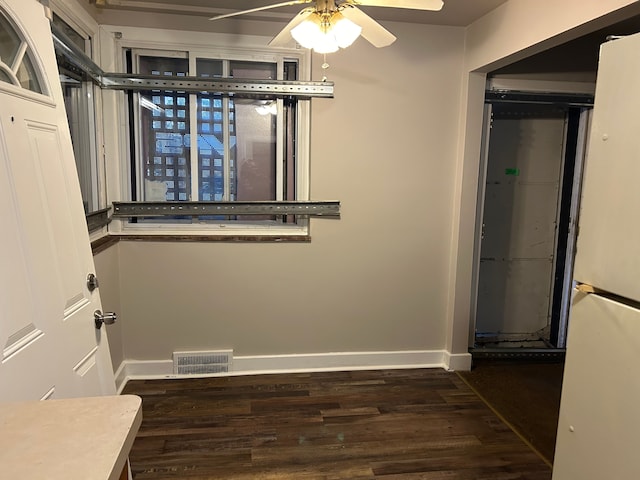 bathroom with hardwood / wood-style floors and ceiling fan