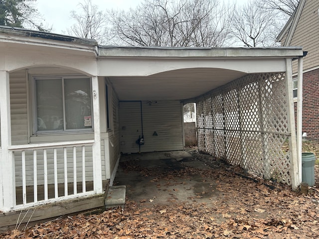 view of vehicle parking featuring a carport