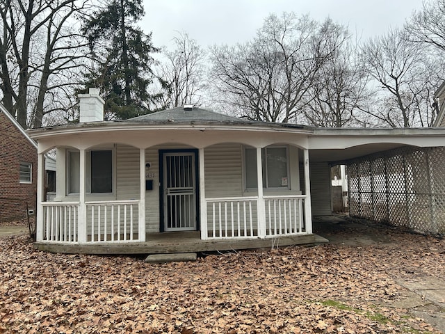 exterior space with a carport